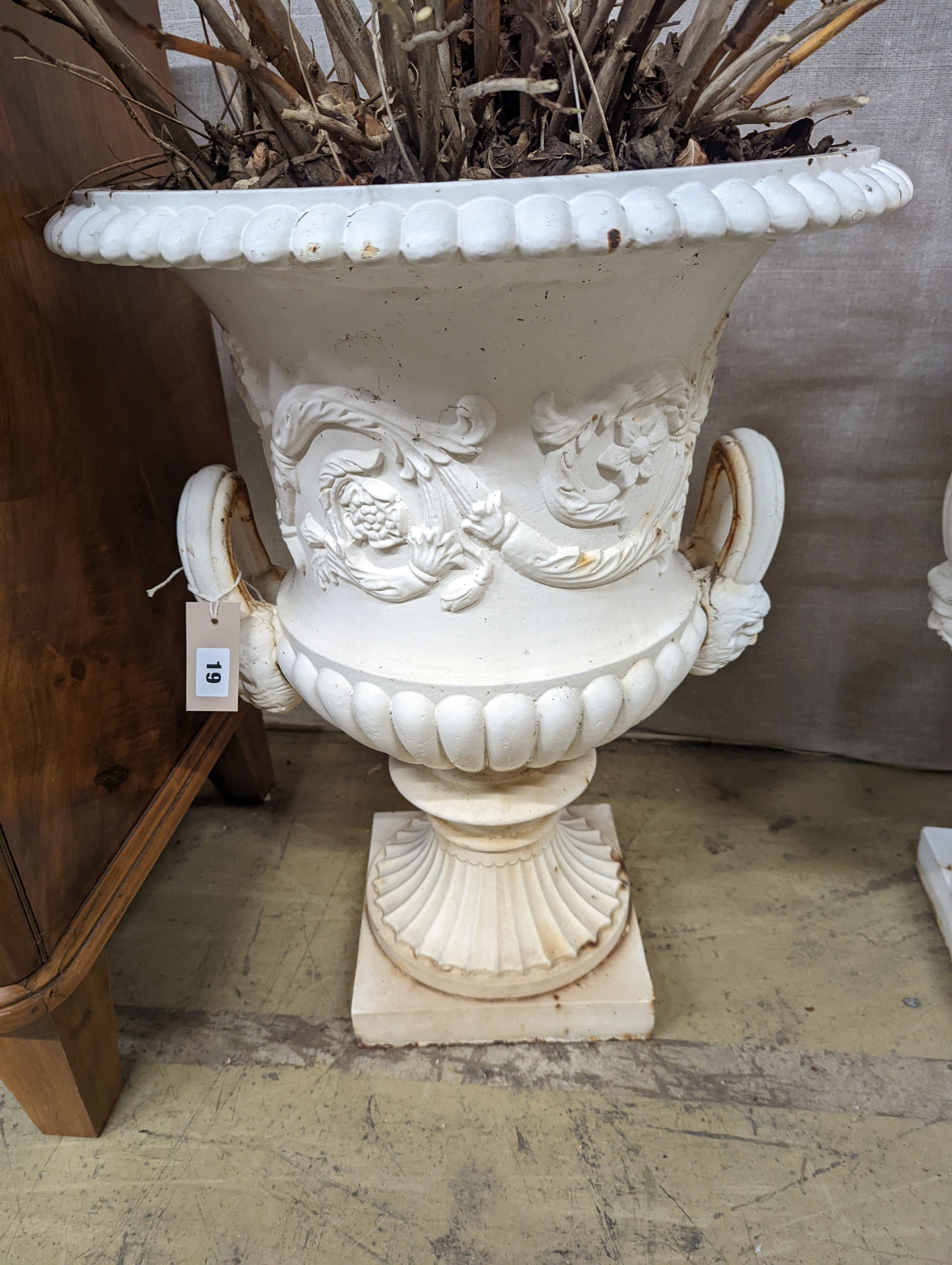 A pair of Victorian style white painted cast metal campana garden urns, height 62cm